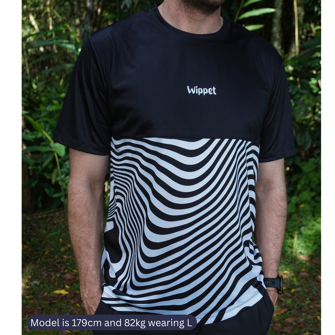 Runners in Wippet lightweight technical running tees with UPF50+ sun protection and fun original prints training on a running track