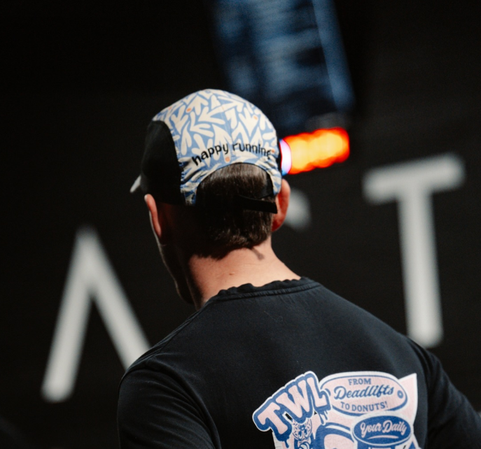 Man wearing Coconut Cool Running cap doing a running session happy running