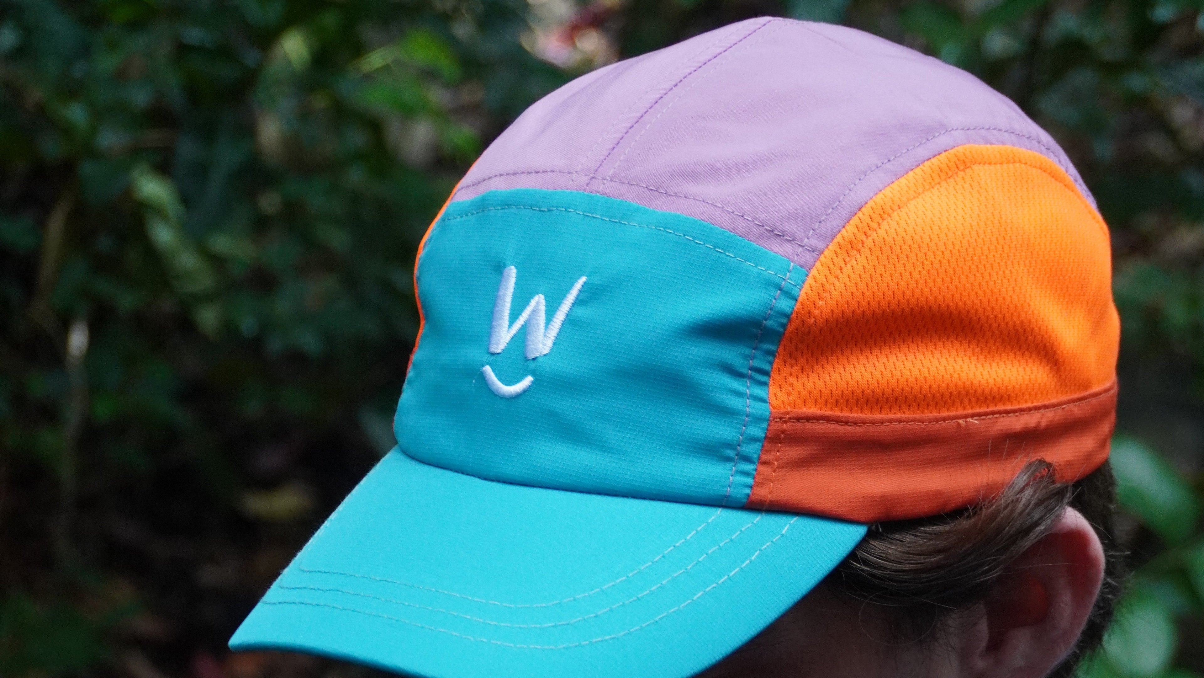 Three athletes in sports attire standing on a track and field, with 'Wippet' branding visible.1621243260e1af0c20-0