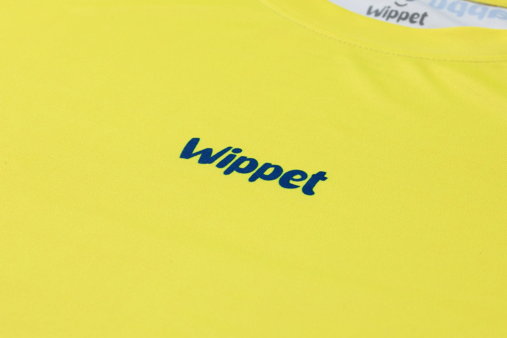 Wippet Running Tee Blazing Yellow – Unisex ultra-light sweat-wicking, breathable running shirt with UPF50+ sun protection and eye catching colors and patterns close up