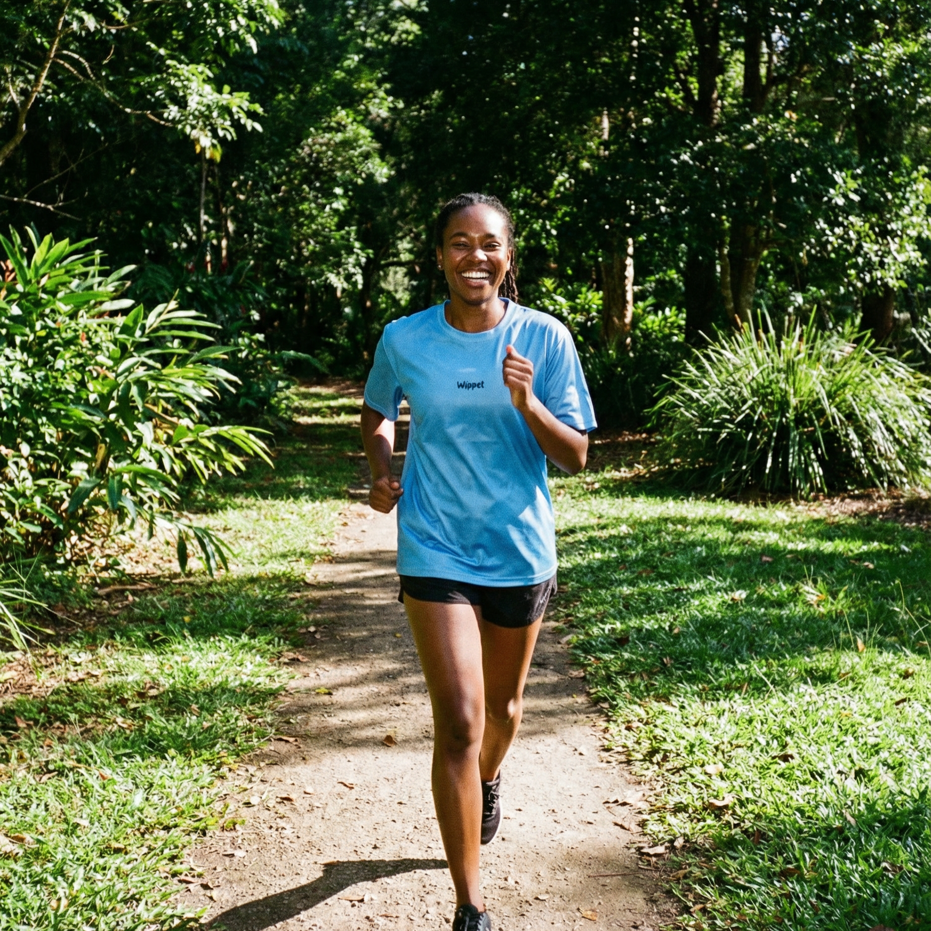 Wippet Running Tee Atomizer worn by woman running– Unisex ultra-light sweat-wicking, breathable, odour resistant running shirt with UPF50+ sun protection and bold colors and patterns close up