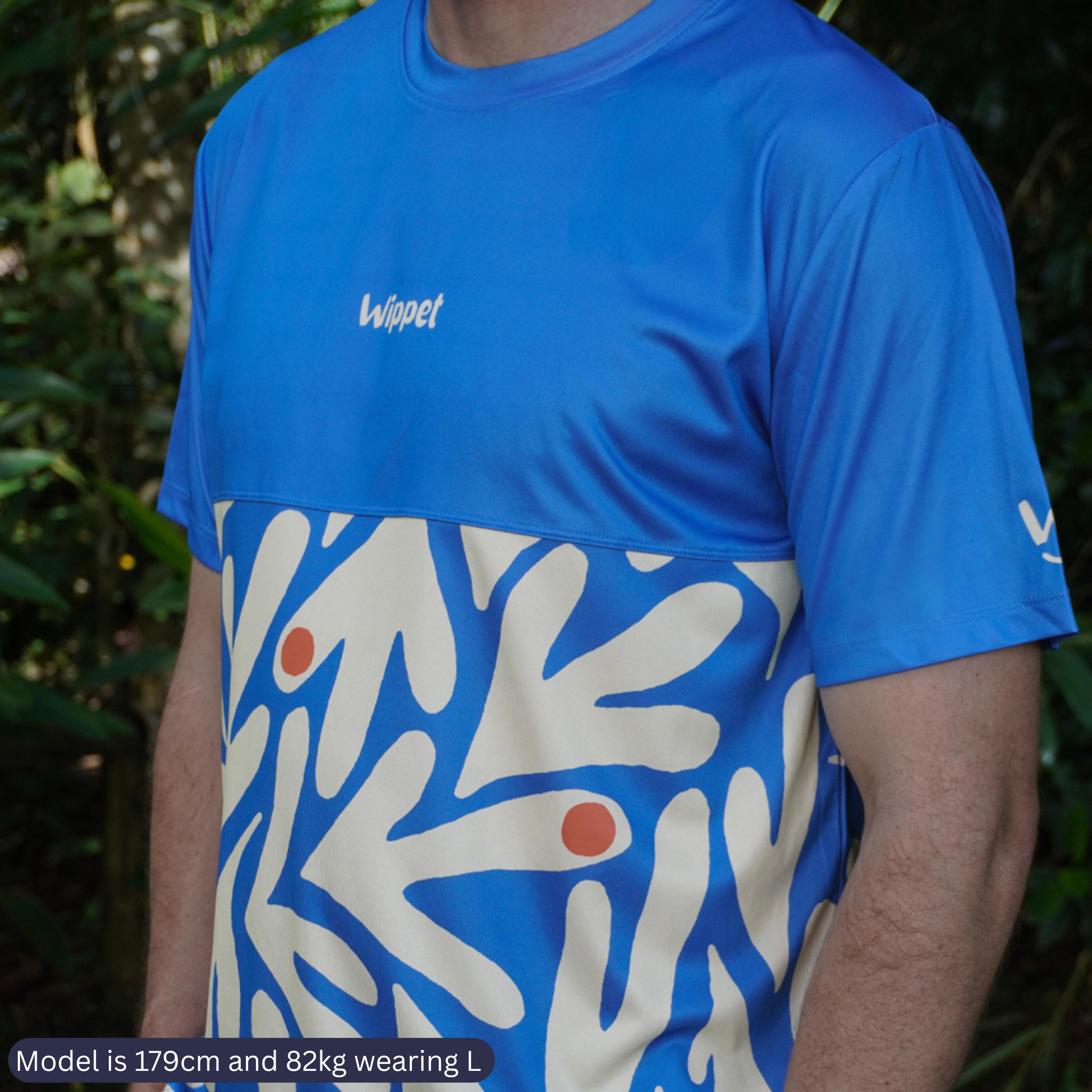 Wippet everyday Coconut Cool running shirt that is black and white, breathable, sun protection and bright and fun for running