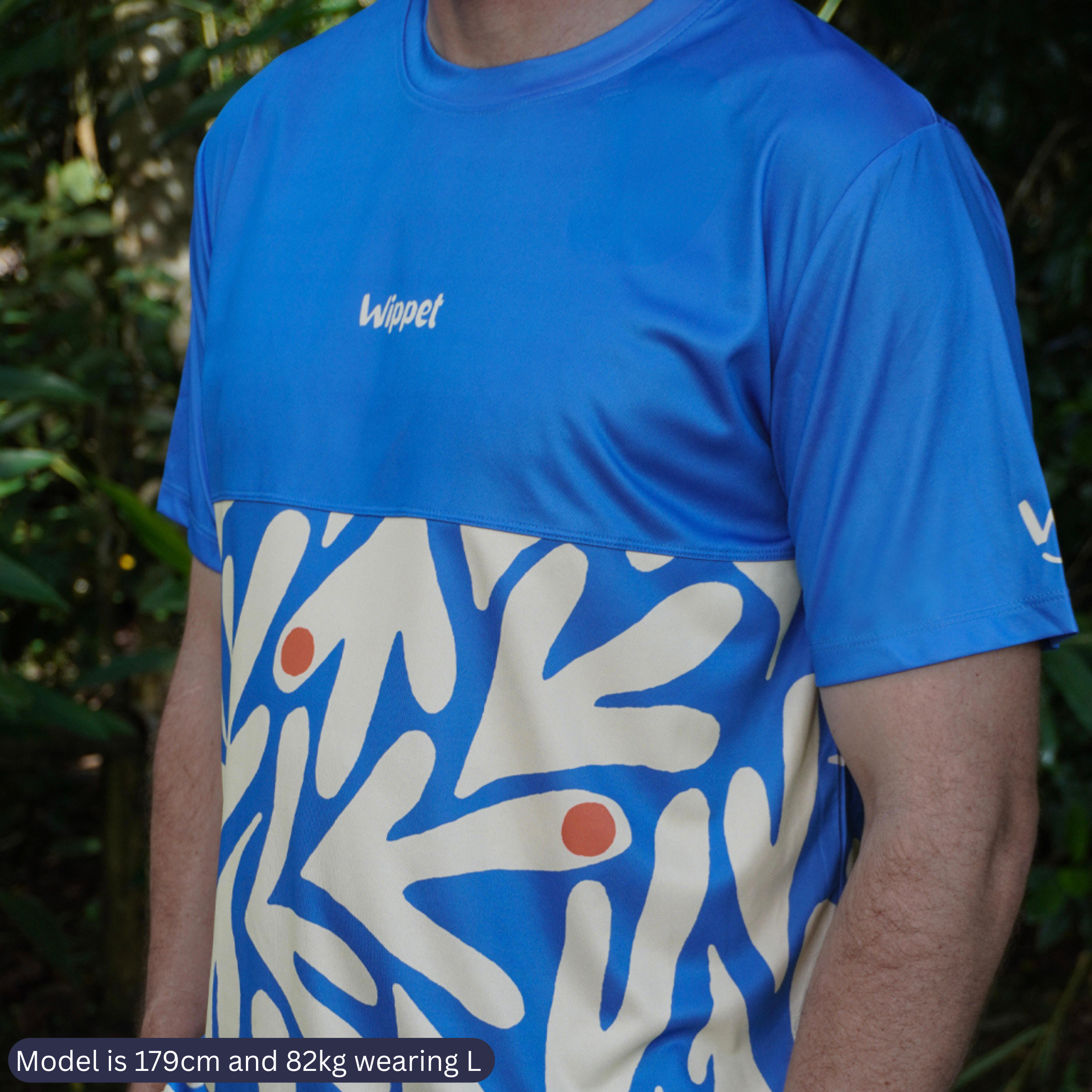 Wippet everyday Coconut Cool running shirt that is black and white, breathable, sun protection and bright and fun for running