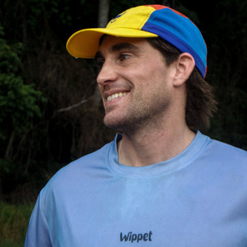 Men's blue Wippet running tee and running cap with UPF50+ sun protection, moisture-wicking technology and fun colour panelling