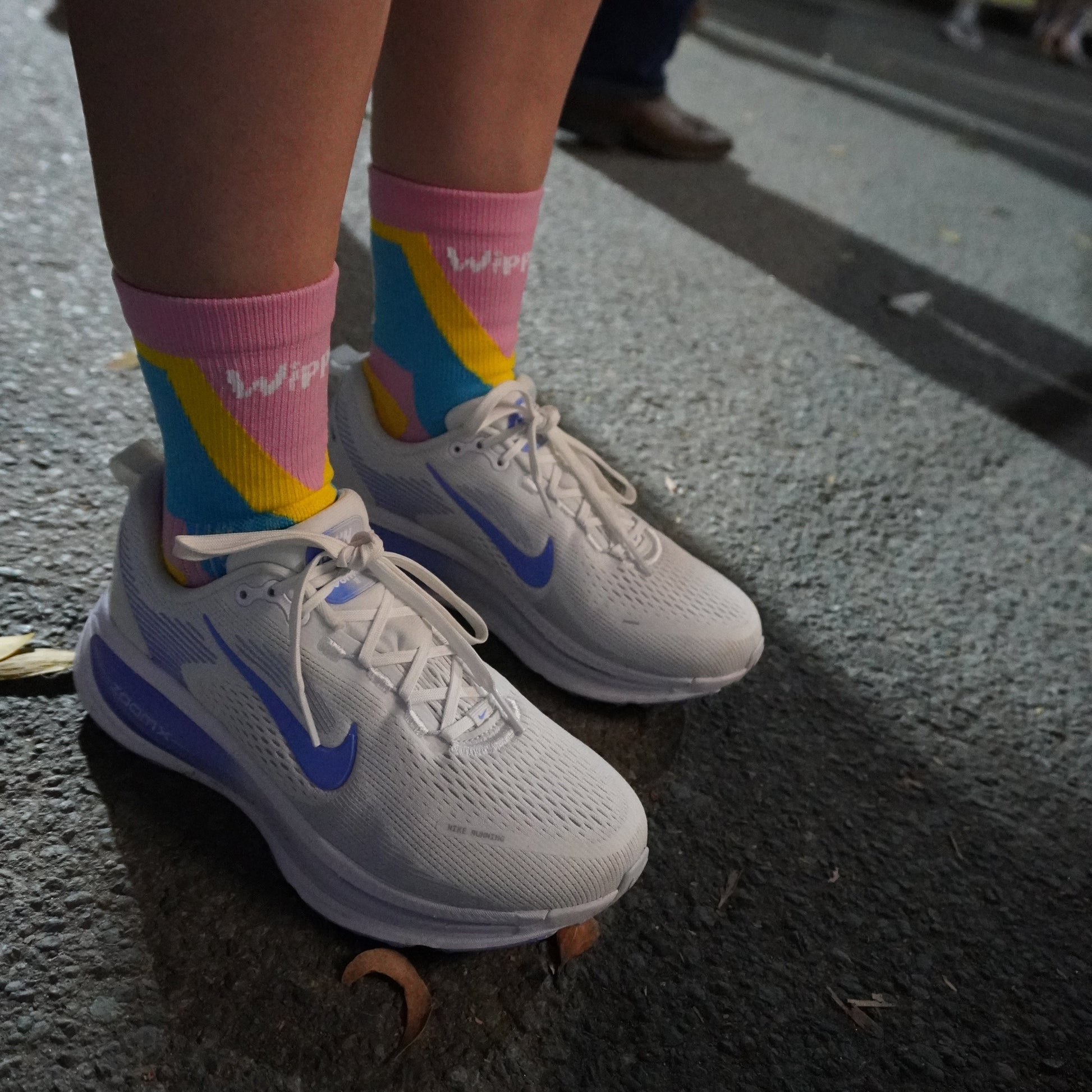 Race running sock that is colourful, breathable, reduces blisters, compresses the foot by Wippet being worn at Noosa Marathon.