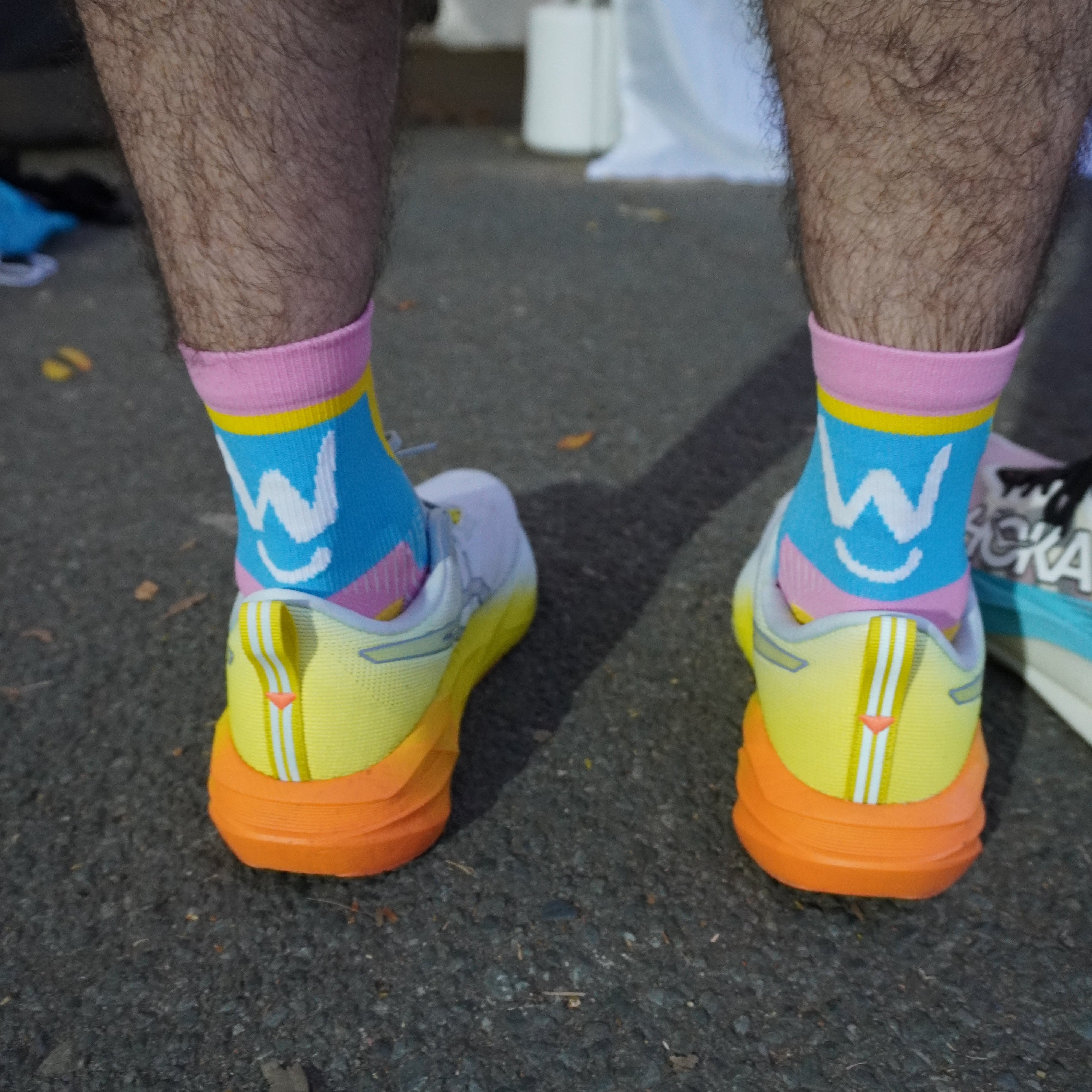 Running sock that is colourful, breathable, reduces blisters, compresses the foot by Wippet being worn at Noosa Marathon.