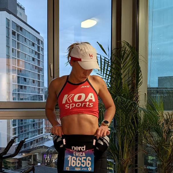 Woman in running gear for Gold Coast Marathon wearing Wippet's breathable, sweat wicking, ultra light weight, sun protective Redline running cap.