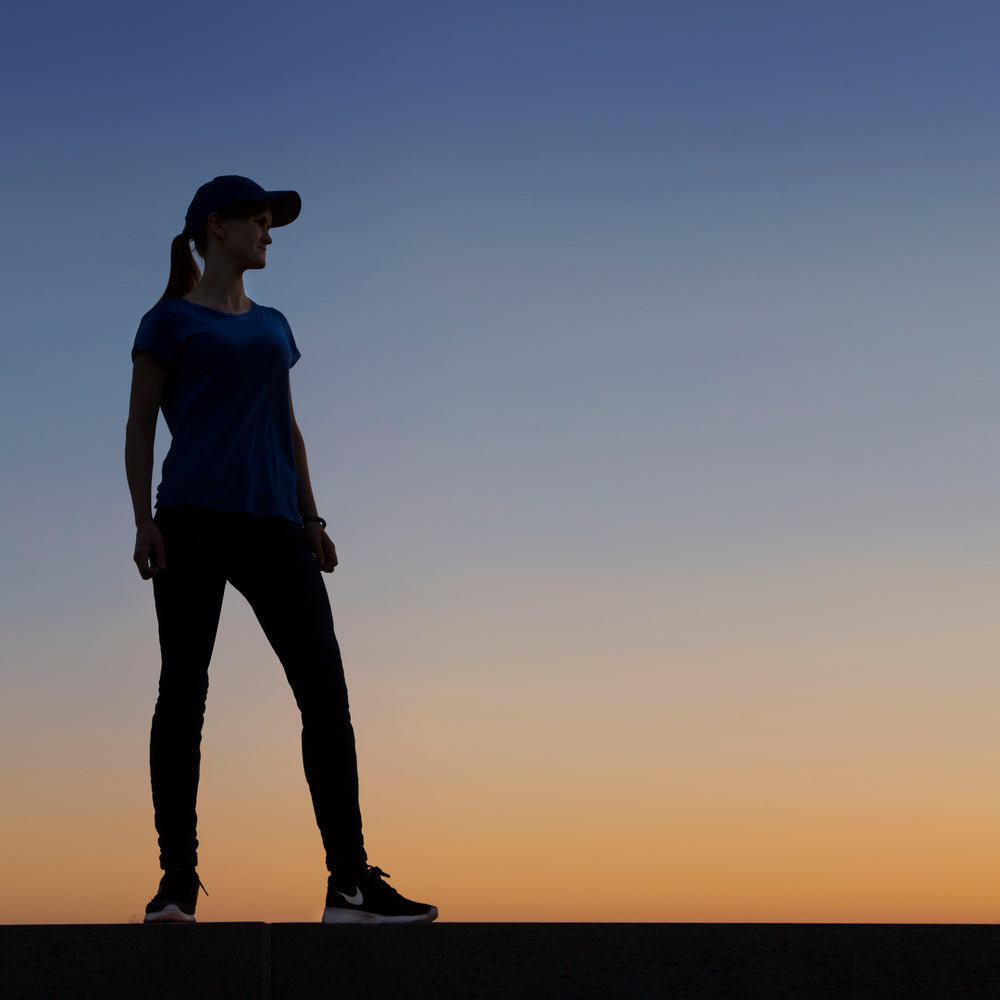 woman-standing-infront-of-perfect-sunset